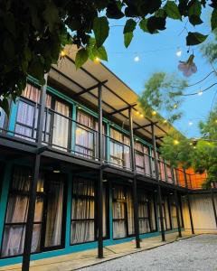 a building with a lot of windows on it at The Cozytainer in Taiping