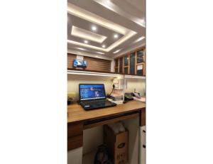 an office with a desk with a laptop on it at Velour Pines Pahalgam in Pahalgām