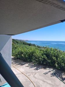 a view of the ocean from a balcony at Закоханий у море in Odesa