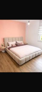 a large bed in a bedroom with a white bedspread at Mare Nostrum Suite in Vir +6 photos