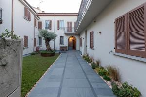 a courtyard of a house with a walkway at Antica Corte Lugo in Lugo