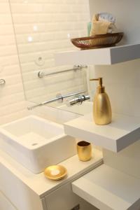 a bathroom with a sink and a mirror at Cozy Flat Porto Downtown in Porto +35 photos