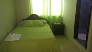 Voodi või voodid majutusasutuse Hostal Punta Arena toas
