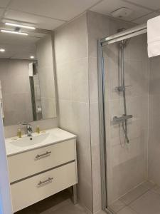 a bathroom with a shower and a sink and a shower at Villa Médicis Trouville-sur-mer in Trouville-sur-Mer +12 photos