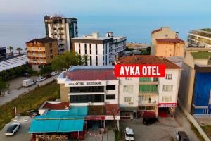 an overhead view of a city with a sign on a building at ATAKAUM AYKA OTEl in Atakum +9 photos