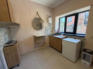 a bathroom with a sink and a mirror at Kond studio in Yerevan