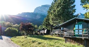 a cabin with a view of a mountain at chalets studio du vieux frêne in Saint-Hilaire