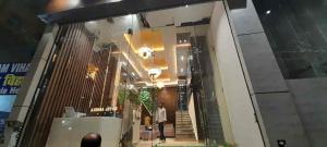 a man walking down a hallway in a building at Hotel New bodhi inn in Gaya