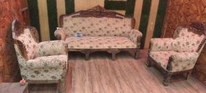 a room with two chairs and a table with a chair and a chair at Hotel New bodhi inn in Gaya