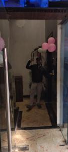 a man taking a picture of himself in a mirror at Hotel New bodhi inn in Gaya