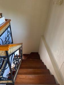 a staircase with a wrought iron railing and a stair case at Приватні апартаменти in Odesa