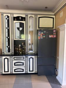 a large entertainment center with a black and white wall at Приватні апартаменти in Odesa +3 photos