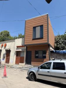 a car parked in front of a house at Kond studio in Yerevan