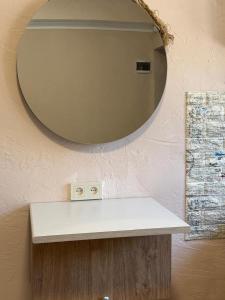 a bathroom with a mirror and a white counter at Kond studio in Yerevan