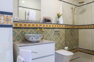 a bathroom with a toilet and a sink at Dar Beate Sousse Medina in Sousse