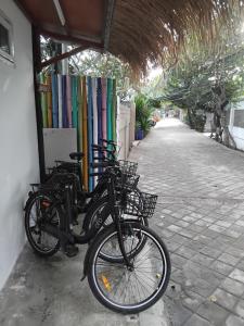 a group of bikes parked next to a building at TottyHouse Gili Trawangan in Gili Trawangan +35 photos