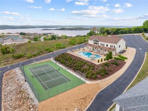 an aerial view of a house with a tennis court at Smirnoff Pointe Lakefront in Hollister