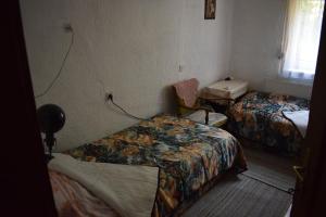 a hotel room with two beds and a window at Tiha Varoš in Varoš
