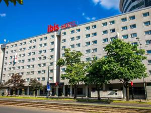 a hotel with a sign on the side of it at ibis Warszawa Centrum in Warsaw
