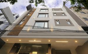 a white building with a lot of windows at Hotel S-mart In Delhi Airport & Free Airport Pickup in New Delhi