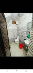 a bathroom with a toilet and a sink at Paras guest house in Mathura