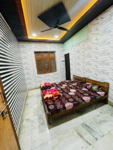 a bedroom with a bed in a room at Paras guest house in Mathura
