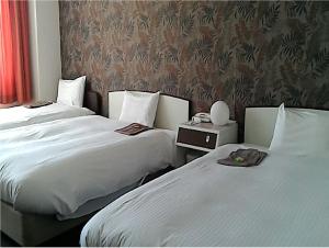 Una cama o camas en una habitación de Heal In Yokkaichi