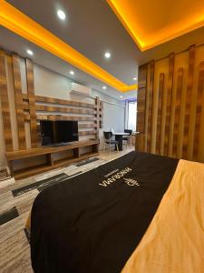 a room with a bed and a tv in it at Panorama Rezidans Kayseri in Kayseri +24 photos