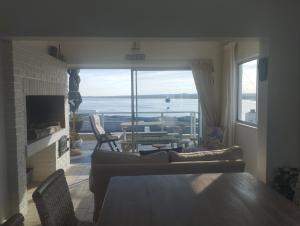 a living room with a view of the ocean at Sea Echo in Yzerfontein