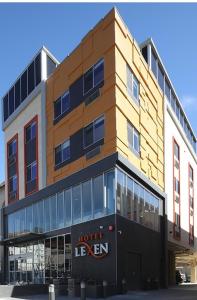 a building with a hotel sign on the front of it at Lexen Hotel - Hollywood in Los Angeles