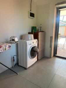 a washer and dryer in a room with a door at Mountain View in Türgen