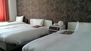 Una cama o camas en una habitación de Heal In Yokkaichi