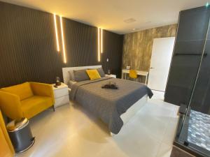 a bedroom with a bed and a yellow chair at Private Room-1 in Miami