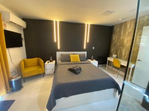 a bedroom with a bed and a yellow chair at Private Room-1 in Miami