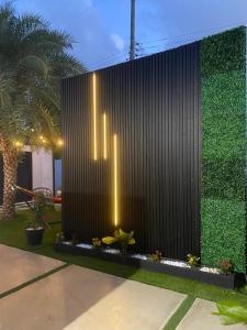a fountain in a courtyard with plants and lights at Private Room-1 in Miami