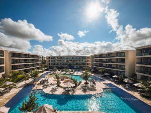an image of the pool at the resort at Malia Beach - Muro Alto - Porto de Galinhas - Cozinha equipada in Porto De Galinhas