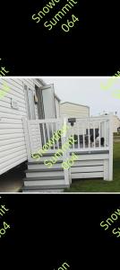 a picture of a white house with a porch and stairs at Snowdon summit 064 in Barmouth