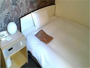 Una cama o camas en una habitación de Heal In Yokkaichi