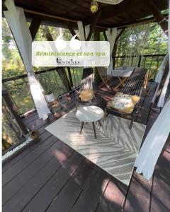 a porch with chairs and a sign that reads reinvention of sun spa at Cabanes et Spa Les Landines in Origne +29 photos