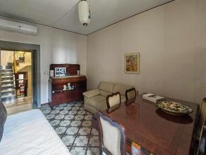 a living room with a table and a couch at Nautilus in Cuglieri