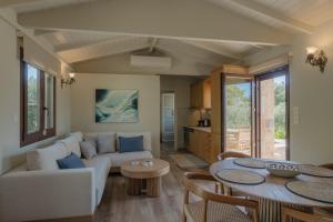 a living room with a couch and a table at Millstone Summerhouse in Pachis