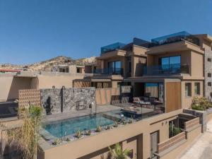 an image of a house with a swimming pool at Lapis Nera Villas - Beachfront & "Free" Heated Pools in Psari Forada +71 photos