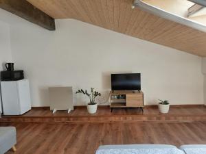 a living room with a flat screen tv on a white wall at Ubytovanie Čadca 2026 in Čadca