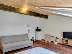 a living room with a couch and a flat screen tv at Ubytovanie Čadca 2026 in Čadca +8 photos