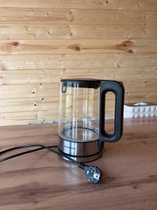 a blender sitting on top of a wooden table at ALAU villas in Saty