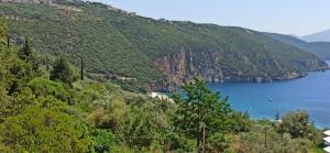 a view of a mountain with a body of water at Ariadni Fountas Studios in Parga