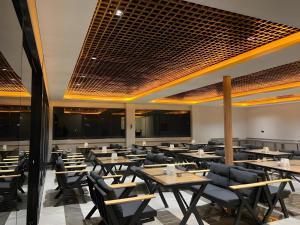a dining room with tables and chairs at Otel OrtaDoğu in Urfa