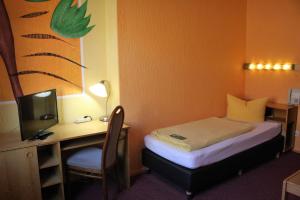 Postel nebo postele na pokoji v ubytování Hotel Graf Pückler