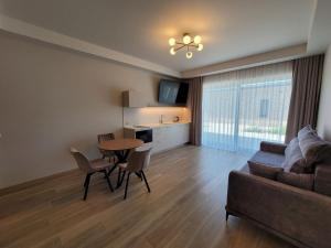 a living room with a couch and a table at Klaipedarent in Klaipėda
