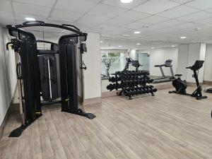 a gym with several treadmills and tread machines at Hotel & Spa Peñiscola Palace in Peniscola